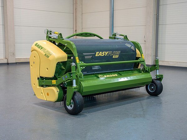 Cabezal de hierba con oprimidor de rodillos