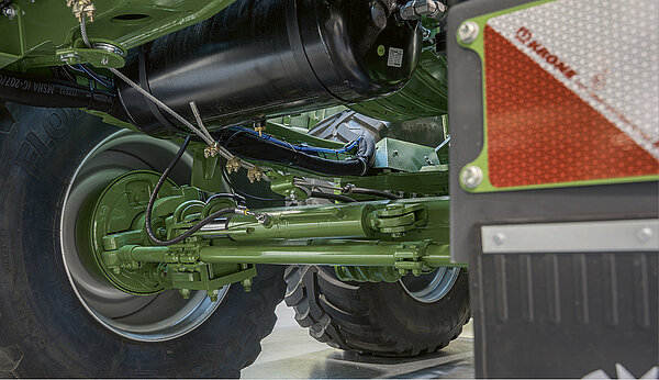 Eje tándem con guiado por arrastre